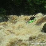 Photo of the Dargle river in County Wicklow Ireland. Pictures of Irish whitewater kayaking and canoeing. Dave Carroll on the Main Falls in medium high water. Photo by Rob Coffey